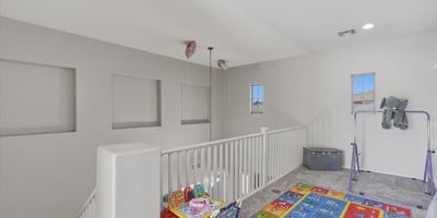 Large loft area overlooking the main entry, offering flexible space for a playroom, lounge, or second living room.