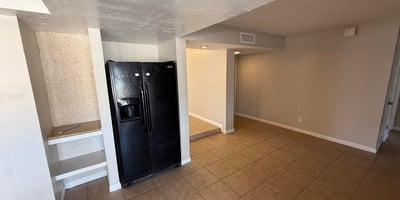 Kitchen and dining area with tile floors and smooth flow to surrounding living spaces. The open layout makes everyday meals and gatherings easy in this Glendale home.