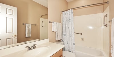 Hall bathroom featuring a tub-shower combo, vanity storage, and neutral finishes. This Phoenix home offers practical design and clean presentation.