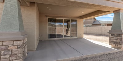 Covered patio with direct access to interior living spaces, enhancing flow for entertaining and everyday living.