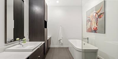 Beautiful primary bath with soaking tub, dual sinks, and sleek finishes, creating a spa-like environment in this updated Phoenix home.