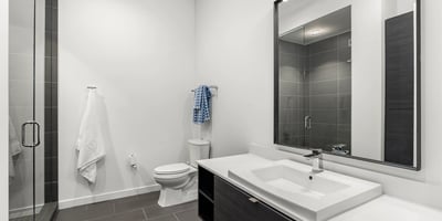 Modern guest bathroom featuring a glass walk-in shower, updated fixtures, and clean contemporary finishes in this Phoenix property.