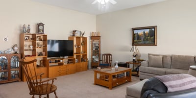 Spacious Phoenix living room with neutral finishes, ample seating, and inviting atmosphere designed for everyday comfort and gatherings.