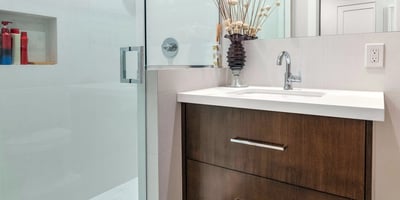 Contemporary bathroom featuring a glass-enclosed shower, modern vanity, and clean design elements in this updated Phoenix residence.