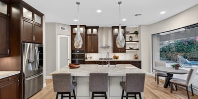Light-filled kitchen with modern finishes, large island, and open layout connecting seamlessly to the Scottsdale living space.