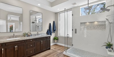 Contemporary Scottsdale bathroom with a large walk-in shower, rainfall fixture, and sleek tile finishes for a spa-like experience.