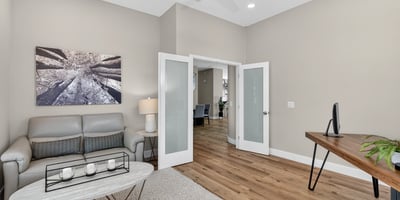Flexible Scottsdale bonus room with double doors, natural light, and modern finishes, perfect for office or sitting area.