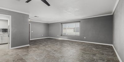 Open living room with natural light, neutral tones, and updated finishes. This Sun City home is move-in ready with a functional layout.