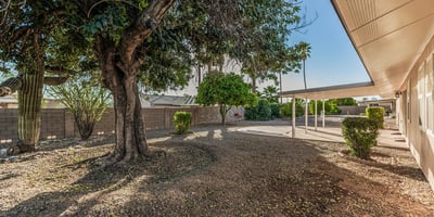 Generous backyard with covered patio and established landscaping. This Sun City home highlights comfortable outdoor living and entertaining potential.