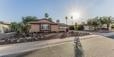 Beautiful front yard with desert landscaping, mature greenery, and attractive curb appeal. This Sun City home offers easy-care outdoor spaces and a welcoming exterior.