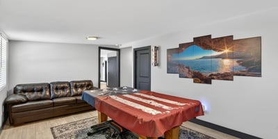 Comfortable lounge area paired with game space, showcasing the flexibility and livability of this remodeled Phoenix property.