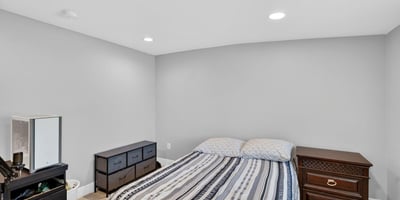 Comfortable guest bedroom with clean finishes, modern flooring, and flexible layout options.