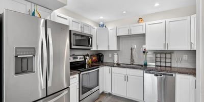 Sleek kitchen in Scottsdale with stainless steel appliances, contemporary cabinetry, and durable counters for a clean, updated look.