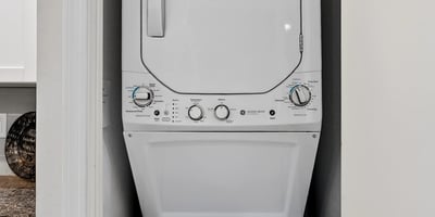 Efficient Scottsdale laundry area with stacked washer and dryer, offering convenience and practicality within the home.