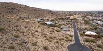 Wide panoramic aerial view capturing stunning desert landscapes, valley scenery, and hillside surroundings. This luxury Phoenix homesite offers privacy, views, and custom home potential in a scenic setting.