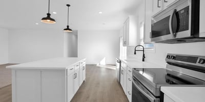 Expansive great room designed for modern living, offering generous square footage and seamless connection to the kitchen. The open-concept floor plan creates an inviting environment for entertaining and daily activities.