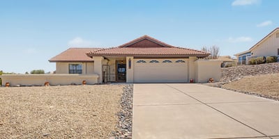 Attractive single-level residence showcasing classic Arizona architecture, a spacious driveway, and low-maintenance desert landscaping. This Fountain Hills property offers beautiful curb appeal and mountain-view surroundings.