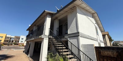 Exterior view of the apartment community featuring covered balconies, upper-level access, and low-maintenance desert landscaping. This Glendale property offers convenience, accessibility, and proximity to popular shopping and entertainment destinations.