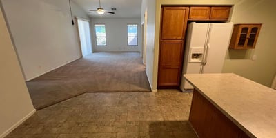 Open kitchen overlooking the spacious living area, creating excellent flow throughout the home. The functional layout encourages gathering, entertaining, and comfortable day-to-day living.