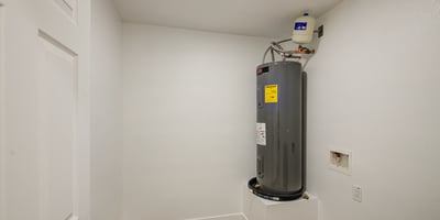 Conveniently designed, this laundry room includes washer and dryer hookups, an updated water heater, and extra utility space to simplify everyday household tasks.