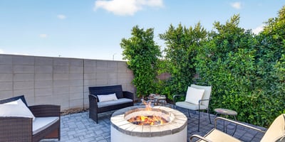 Relax with family and friends around the custom fire pit surrounded by attractive pavers, mature landscaping, and a private hot tub. This outdoor retreat is perfect for enjoying beautiful Arizona evenings.