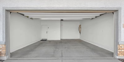 A clean and spacious attached two-car garage provides room for vehicles, storage, recreational equipment, and convenient access into the home.