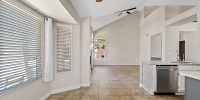 Large windows fill the breakfast nook with natural light while offering views toward the backyard and pool. Conveniently located next to the updated kitchen, this welcoming space is ideal for casual dining.