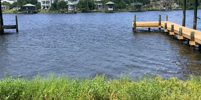 Waterfront property featuring private dock access, offering stunning views and opportunities for outdoor activities.