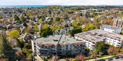 Spacious multi-unit complex surrounded by vibrant greenery, conveniently located near coastal views and local amenities.