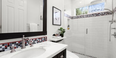 Bathroom 2-Modern bathroom featuring a spacious walk-in shower, sleek fixtures, and vibrant tile accents.