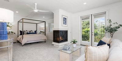 Bedroom 3-Spacious Primary bedroom suite featuring a cozy fireplace and direct access to a private balcony with private views galore