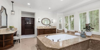 Primary Bathroom -Spacious bathroom featuring a luxurious soaking tub, spacious walk in shower, TV, Toto Neocrest Toilets and a beautifully crafted vanity area. (TV included)