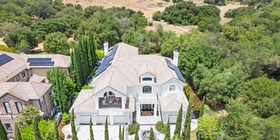 stunning views, surrounded by lush landscaping and open countryside.