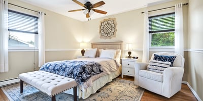 Serene primary bedroom with natural light.