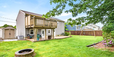 Backyard with fire pit and shed.