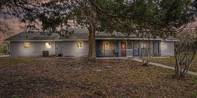 This 3 BR Ranch-style home features an abundance of natural wood and stone accents. Blending country charm with modern convenience, located close to beaches and shopping, this serene 5-acre setting encourages relaxation and creativity.