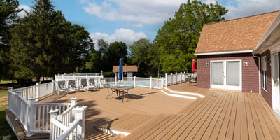 Spacious outdoor deck with a pool, perfect for entertaining and enjoying warm summer days.