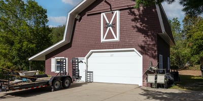 Spacious barn-garage, featuring ample parking and a versatile layout, perfect for various lifestyle needs.