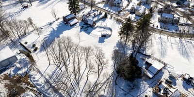 Discover a spacious, snow-covered lot perfect for building your dream home in a peaceful neighborhood.