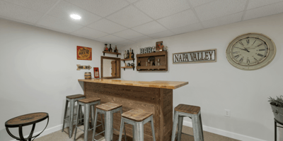 This versatile basement features a well-designed bar area, perfect for entertaining or relaxing with friends.