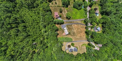 Expansive wooded lot with easy access to local amenities, perfect for private development or investment opportunities.