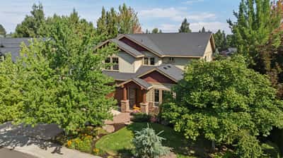 This inviting home features mature landscaping and a spacious layout, perfect for comfortable living and entertaining.