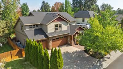 This spacious home features a welcoming entry, landscaped yard, and ample parking in a vibrant neighborhood.