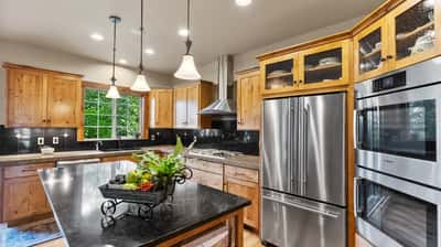 Modern kitchen featuring sleek appliances, ample storage, and a spacious island, perfect for cooking and entertaining.