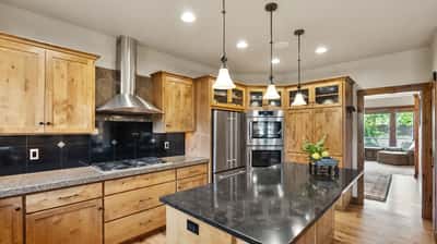 This modern kitchen features sleek countertops, premium appliances, and ample cabinetry for all your culinary needs.