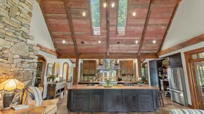 This expansive kitchen features vaulted ceilings, abundant natural light, and a spacious island perfect for entertaining.