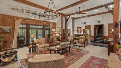 Spacious open-concept living area with rustic wood accents and a unique nautical theme throughout.