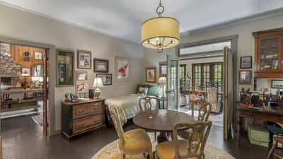 Cozy dining area with natural light, featuring vintage decor and easy access to the inviting living space.