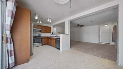 Breakfast nook connects seamlessly with the kitchen and living room, offering an inviting open layout for entertaining and everyday living with convenient backyard access.