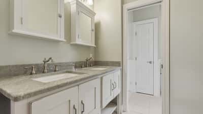 Upstairs full bathroom with double sinks